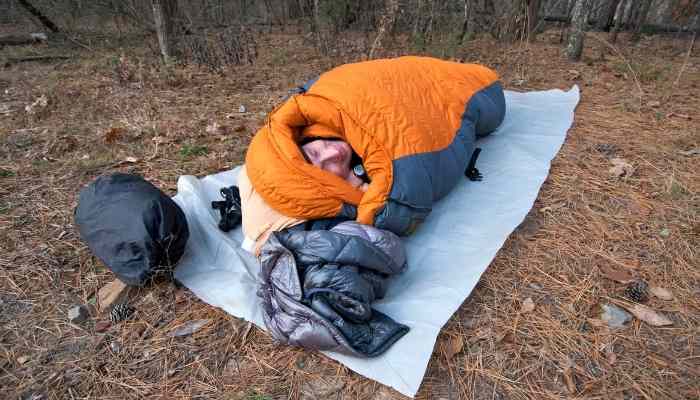 a man in a sleeping bag